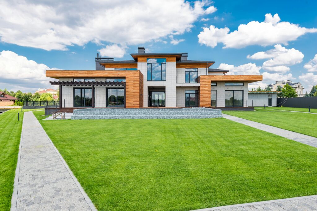 pexels-photo-7031607-7031607 Stunning modern house exterior showcasing spacious lawn and contemporary architecture.